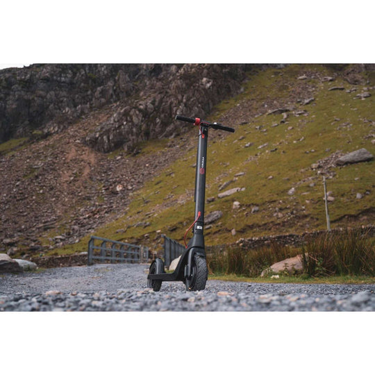 Cruzaa commuta electric scooter riding on rough cobbled terrain